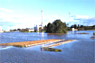 水が溢れた飯盛川の写真：エンターすると大きくなります